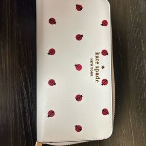 NWOT Kate Spade Cream Wallet with Red Ladybug Design